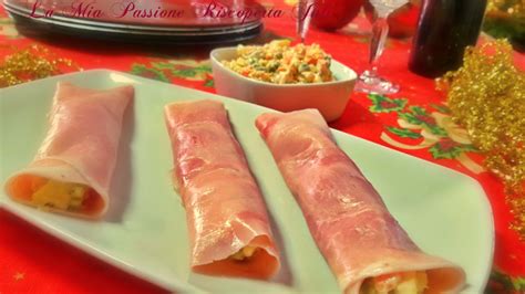 Composizione di un involtino di prosciutto crudo con ripieno di ricotta, pera e glassa balsamica