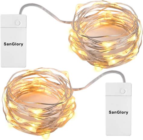 Scatolina delle batterie del filo di luci LED fissata con nastro adesivo