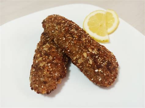 Filetti di merluzzo dorati e croccanti appena scolati dall'olio.