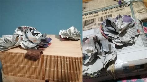 Applicazione di strati di carta di giornale su un palloncino per creare la base di una zucca