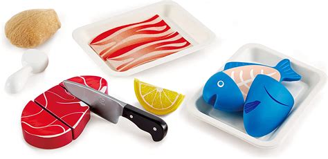 Immagine di un set di gioco in legno per cucinare frittelle, con padella, spatola e frutta