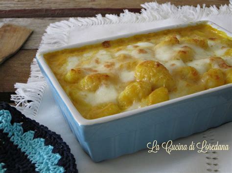 Immagine di gnocchi al forno filanti con mozzarella